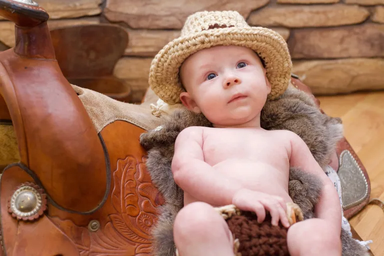 Baby's first portrait, setup in a western theme in California.