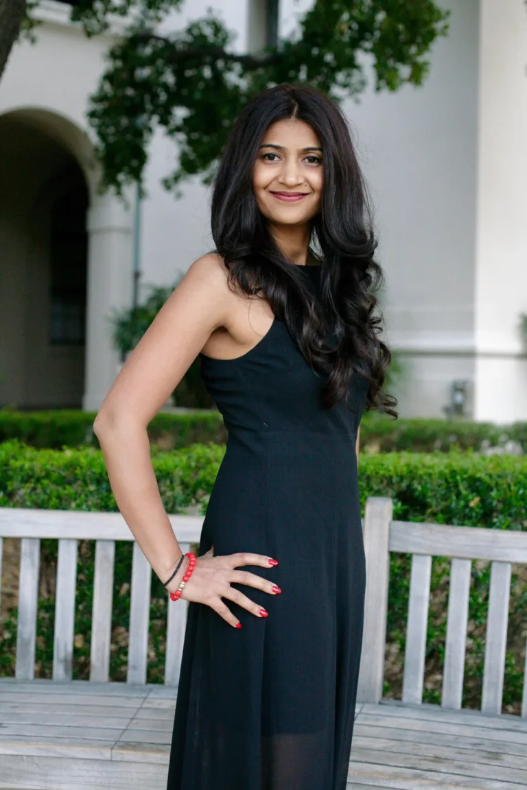 A female posing for her portrait at city hall in Pasadena, California.