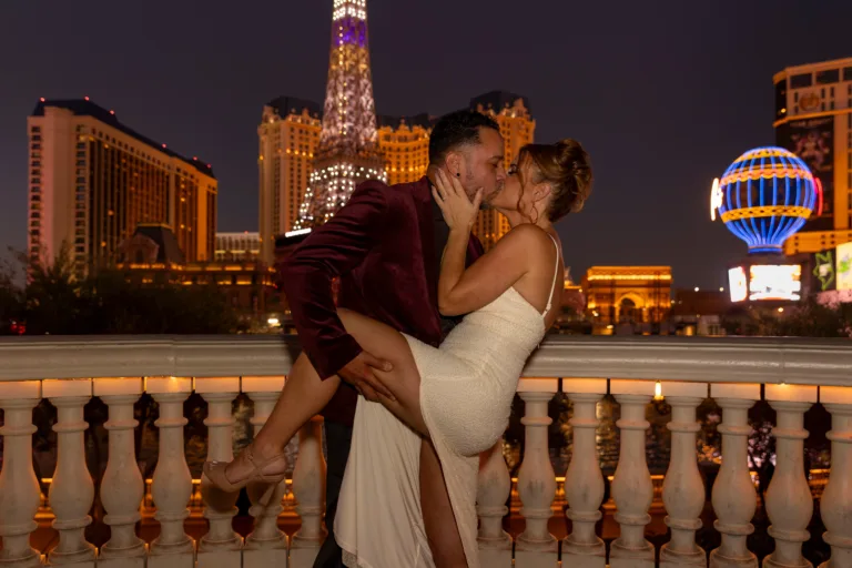 Beautiful wedding portrait of bride and groom sharing a passionate kiss at the Bellagio Hotel in Las Vegas, Nevada.