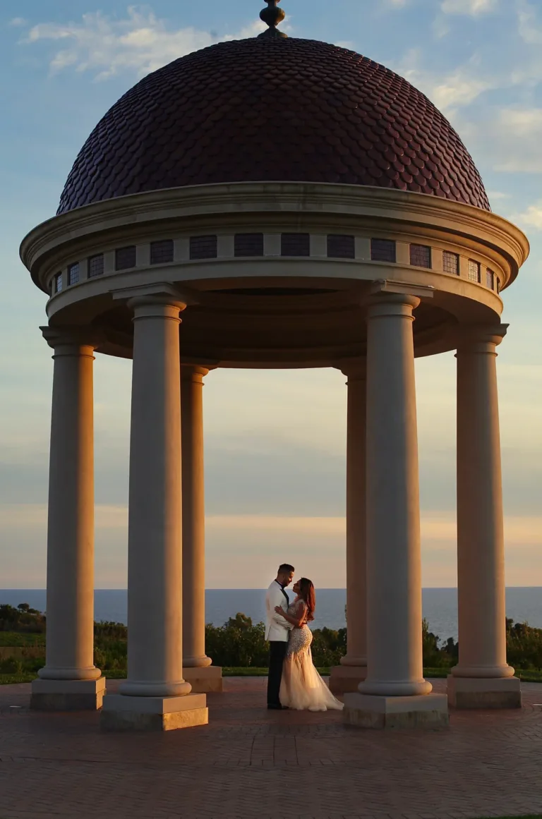 Newlywed couple in a sunset wedding portrait at Pelican Hill Resort in Newport Beach