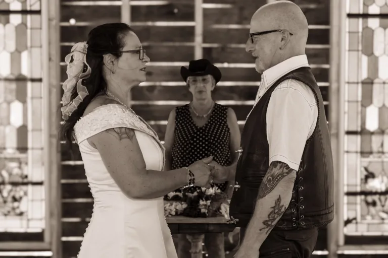 Bride and groom sharing a moment during their wedding ceremony at the Nelson Ghost Town Chapel in Nevada